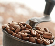 Freshly ground Java™! Close-up view of coffee beans in a grinder.